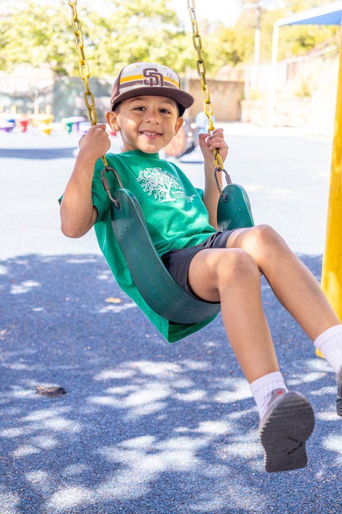 A TK student on a swing.