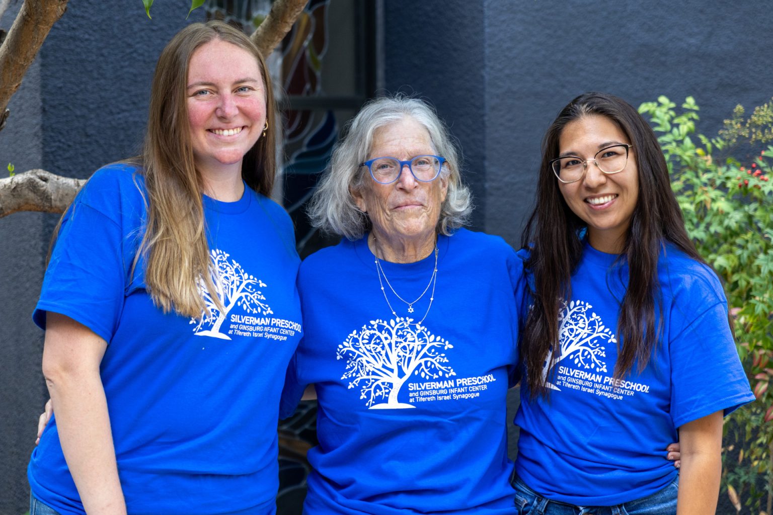 Silverman Preschool Support teachers pose together for a group photo in matching blue shirts.