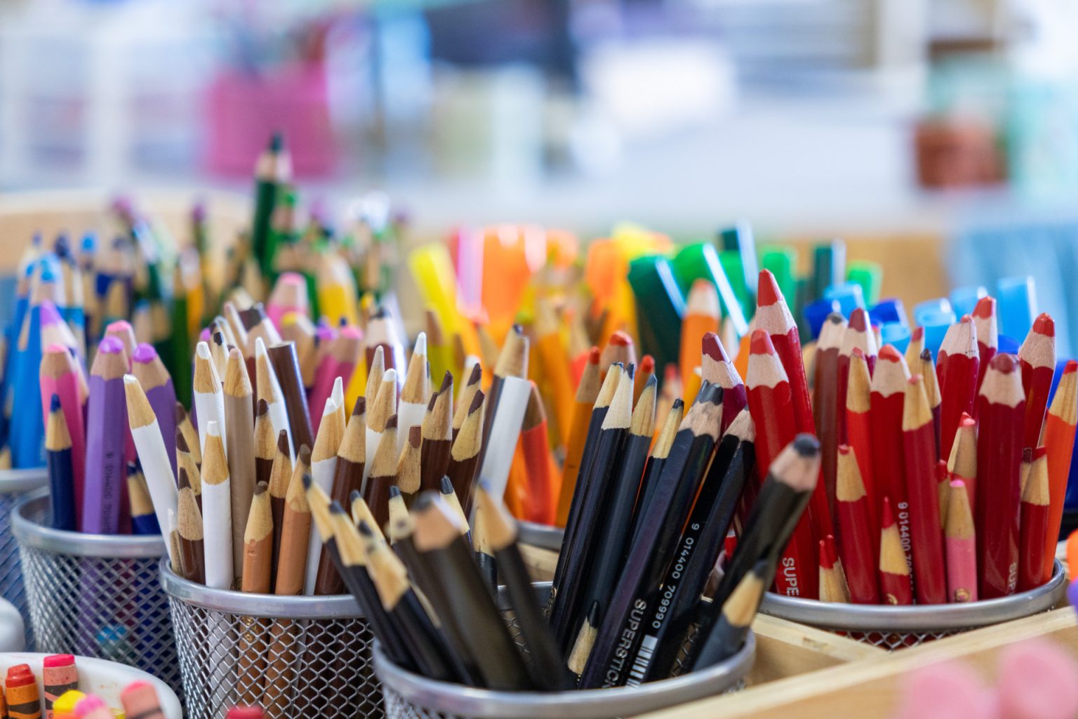 A close-up photo of colored pencils organize by color.