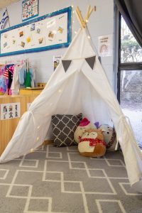Cozy reading nook in a preschool classroom